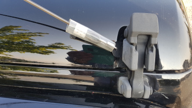 Limb Lifter attached to hood latch 
