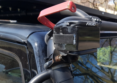 Limb Lifter connected to bracket above lights 